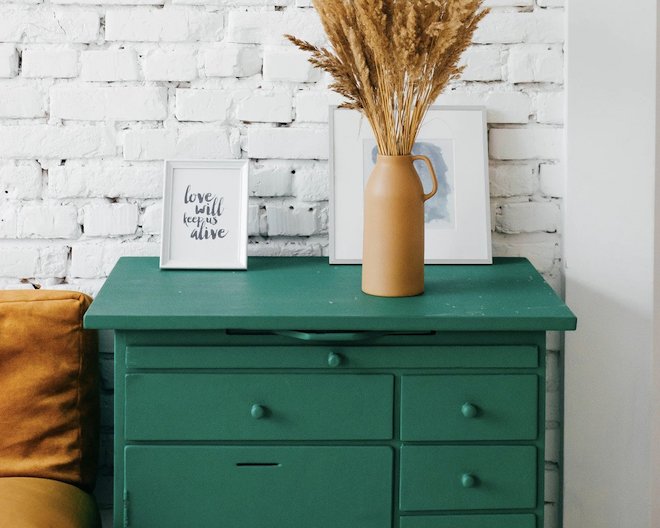 Modern drawers beside a plant